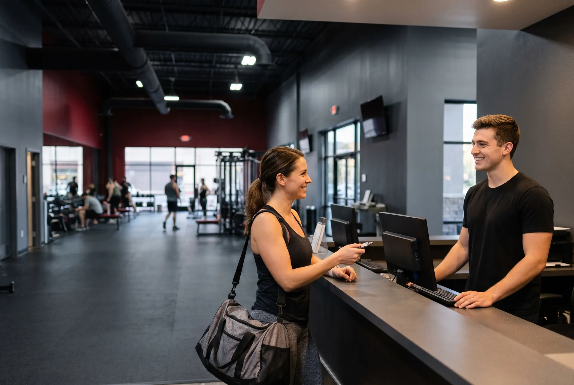 Front desk team member greeting a member at check-in